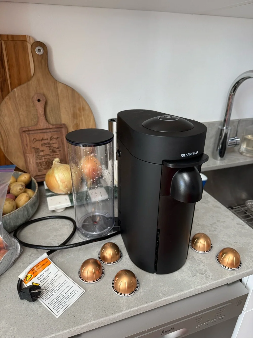 Nespresso VertuoPlus Coffee & Espresso Machine in Black with Gold Capsules